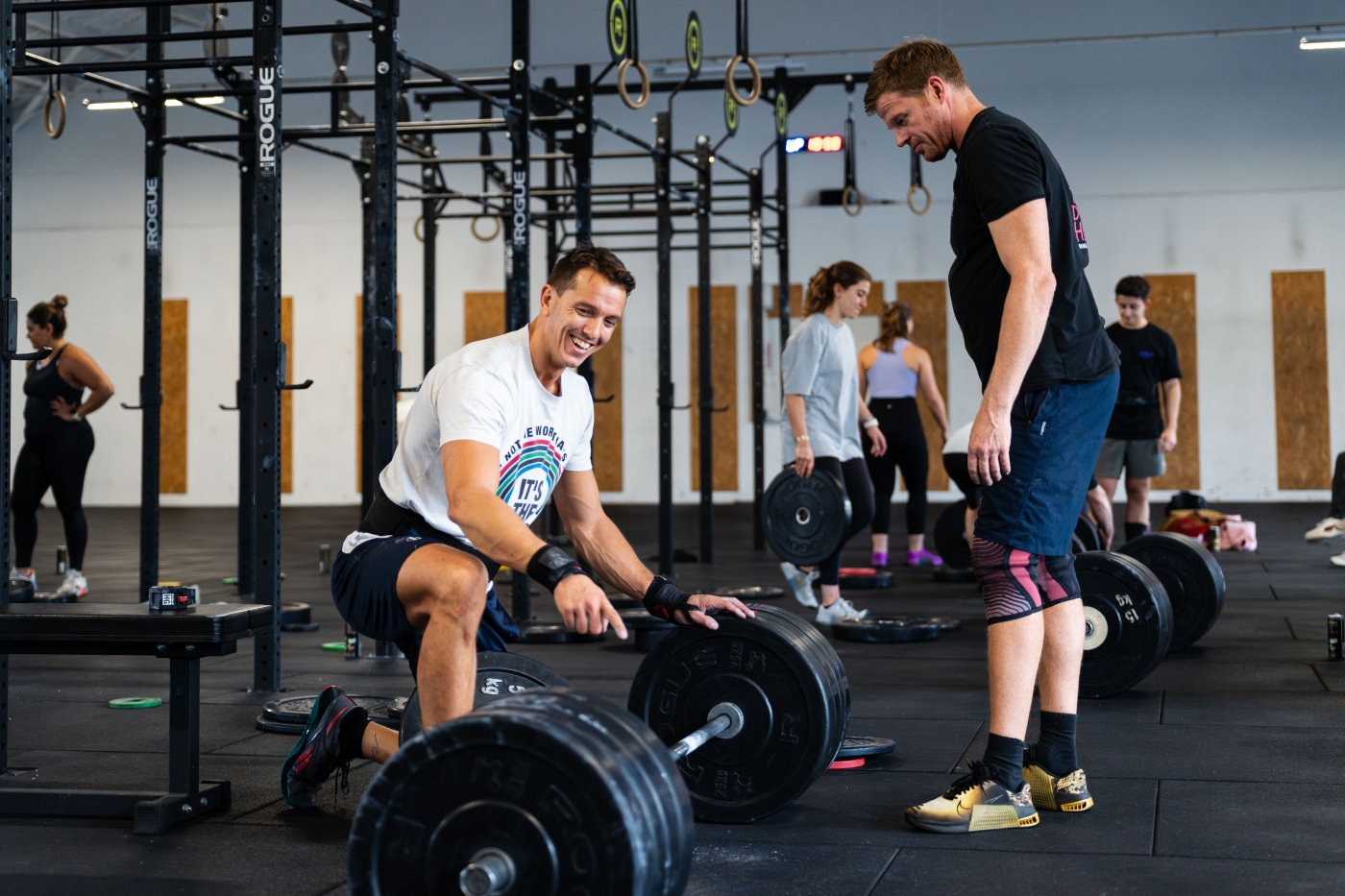 CroffFit, woman loading a bar